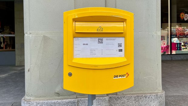 Symbolbild eines gelben Briefkastens.